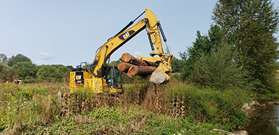 the excavator to help restore Spring Creek